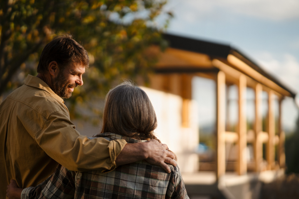 mature-couple-looking-at-their-new-house-under-con-2023-11-27-04-55-27-utc.jpg