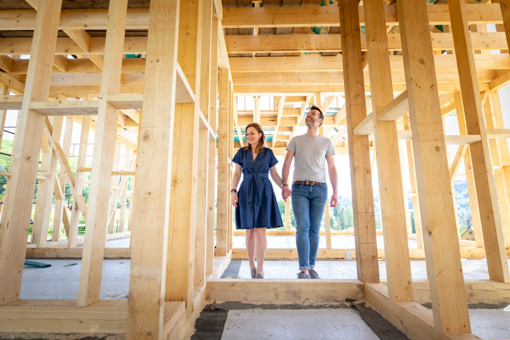 loving-couple-at-construction-site-of-their-new-ho-2023-11-27-05-09-45-utc.jpg