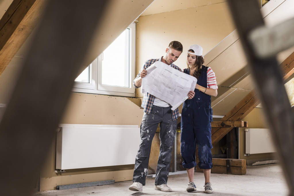 young-couple-on-construction-site-of-their-new-hom-2023-11-27-05-00-42-utc.jpg